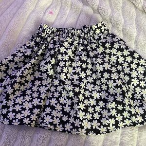 Daisies on black skirt with buttons